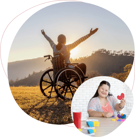 Person in wheelchair with arms raised at sunset